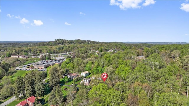 drone / aerial view with a view of trees