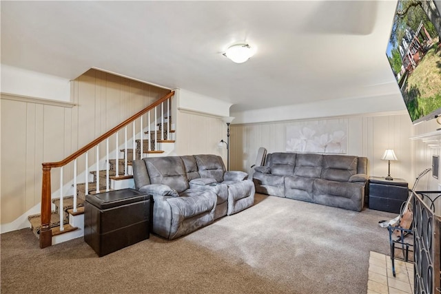 living area featuring stairs and carpet floors