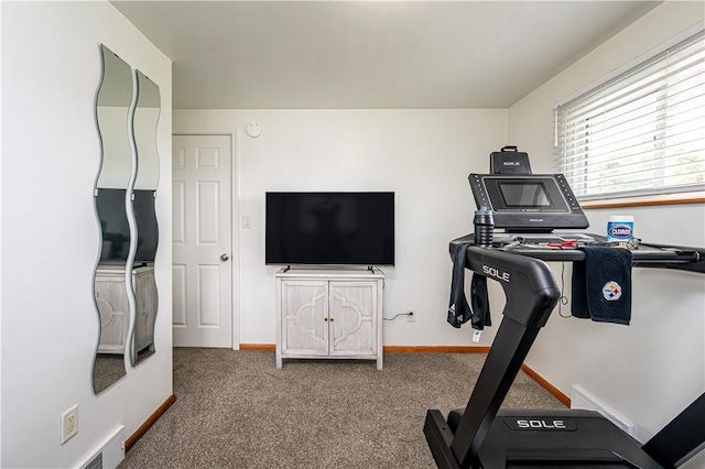 exercise room featuring baseboards, carpet, and visible vents