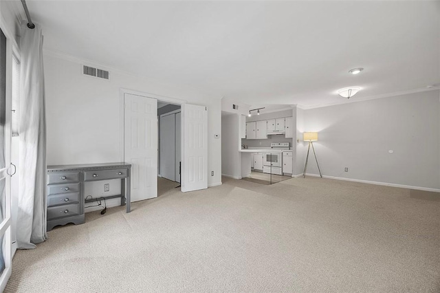unfurnished bedroom featuring light colored carpet, baseboards, visible vents, and ornamental molding