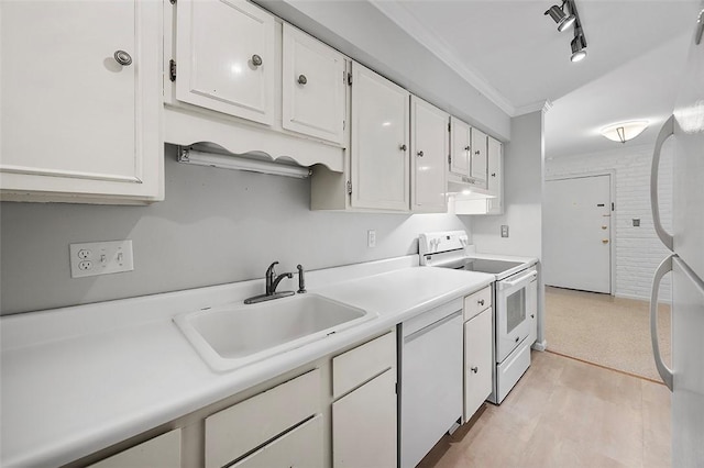 kitchen featuring a sink, light countertops, white cabinets, ornamental molding, and white appliances
