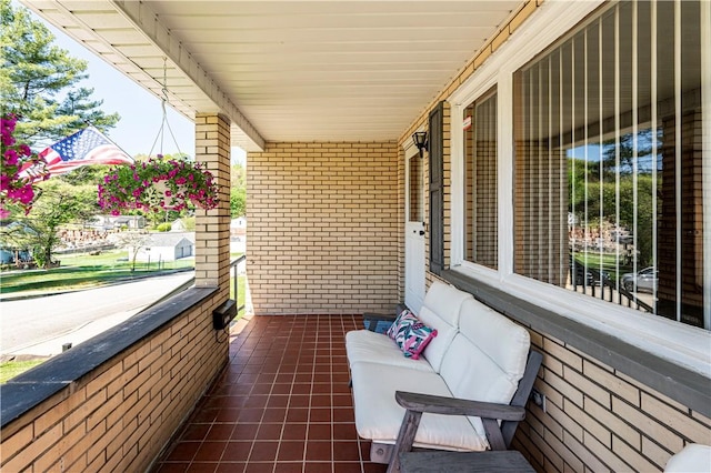 balcony featuring a porch