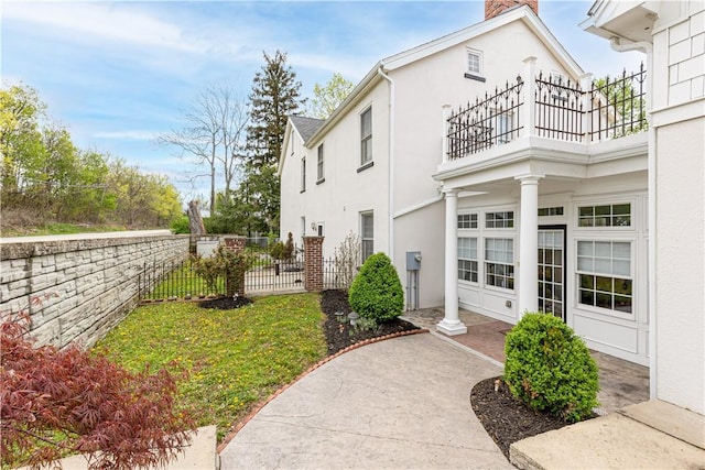 1401 Amity Ridge Rd, Amwell, PA 15301 - view of property exterior with fence, a chimney, stucco siding, and a balcony