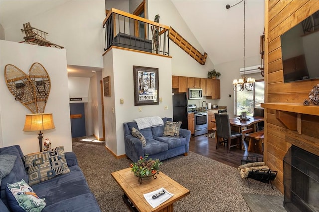 3008 Swiss Mountain Dr, Seven Springs Resort, PA 15622 - living room with high vaulted ceiling, an inviting chandelier, a fireplace with flush hearth, and dark carpet