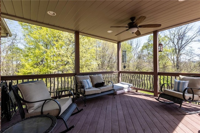 wooden terrace featuring ceiling fan