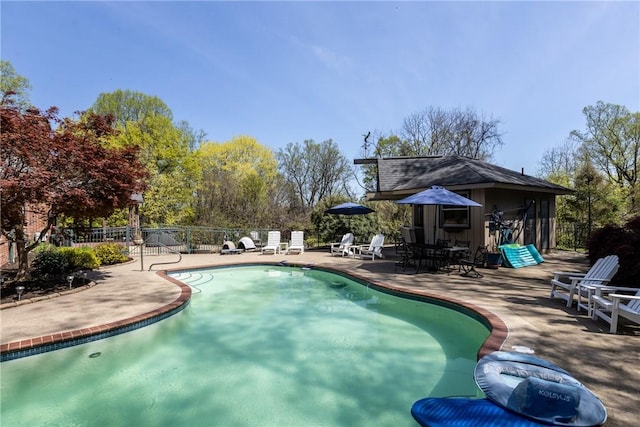 view of swimming pool with a fenced in pool, a patio area, and fence