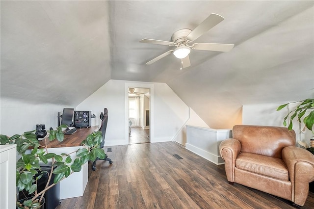 office area with visible vents, wood-type flooring, lofted ceiling, baseboards, and a ceiling fan