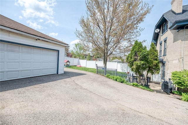garage with fence