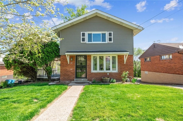 traditional-style home featuring brick siding and a front yard