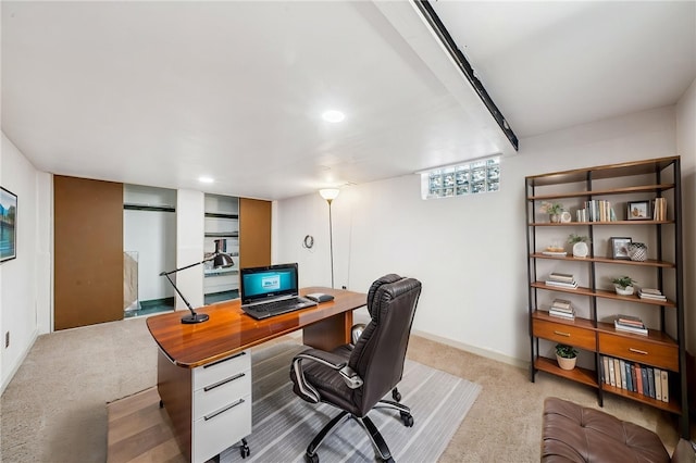 office area with baseboards and carpet