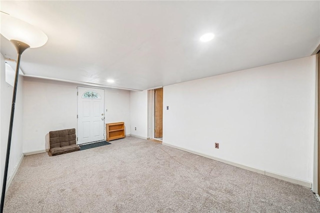 carpeted empty room featuring recessed lighting and baseboards