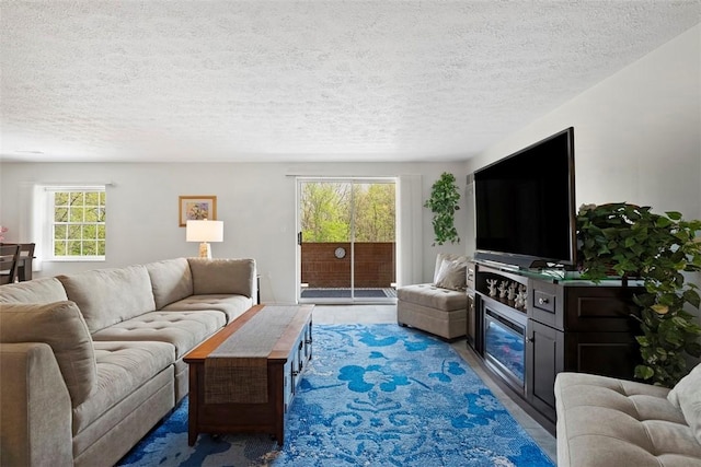 living area featuring a textured ceiling