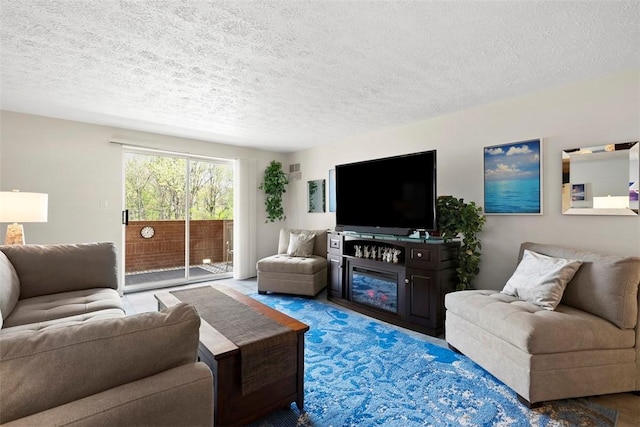 living area featuring a textured ceiling