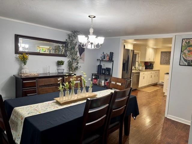 dining space featuring a notable chandelier, ornamental molding, and dark wood-type flooring