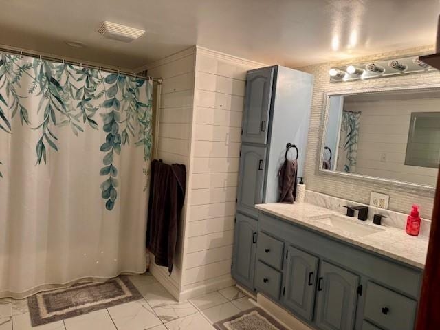 full bath featuring vanity, marble finish floor, curtained shower, and visible vents