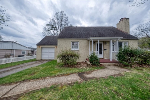 view of front facade featuring fence, an attached garage, a shingled roof, a chimney, and concrete driveway