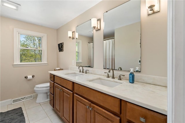 full bathroom featuring a sink, baseboards, tile patterned flooring, and visible vents