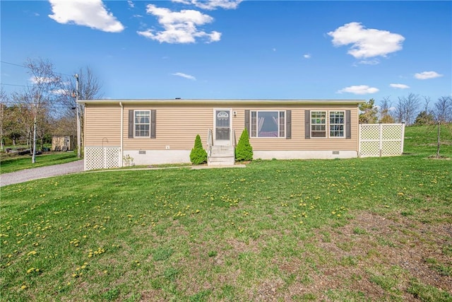 manufactured / mobile home featuring entry steps, a front lawn, and crawl space