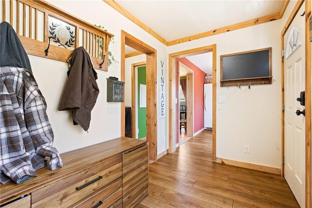 mudroom featuring baseboards and hardwood / wood-style floors