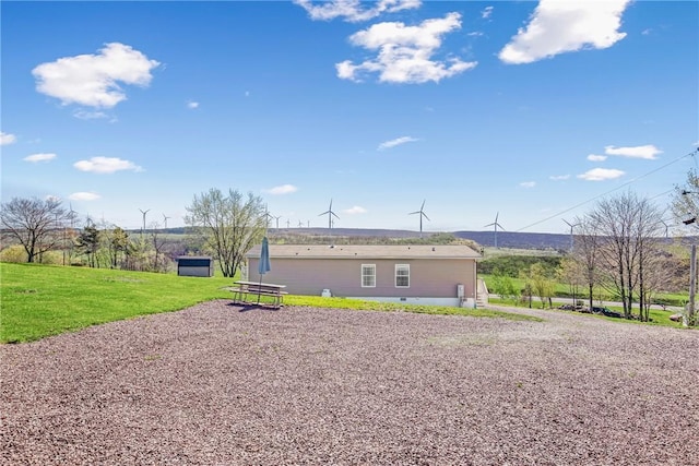back of house featuring a lawn