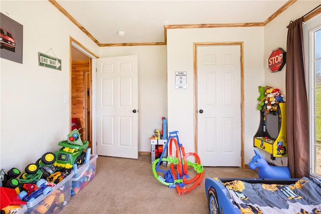 rec room with crown molding and carpet flooring