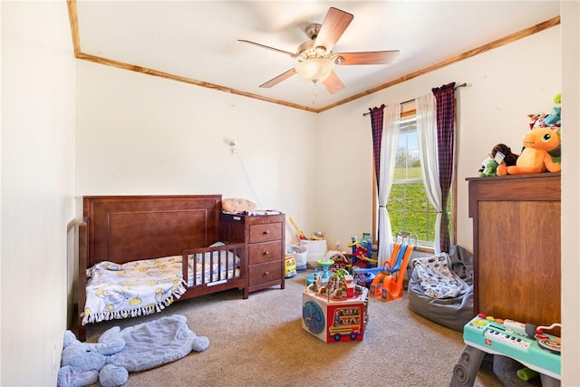 bedroom with crown molding, ceiling fan, and carpet flooring