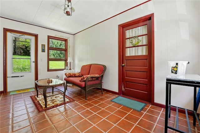 living area featuring baseboards and tile patterned flooring