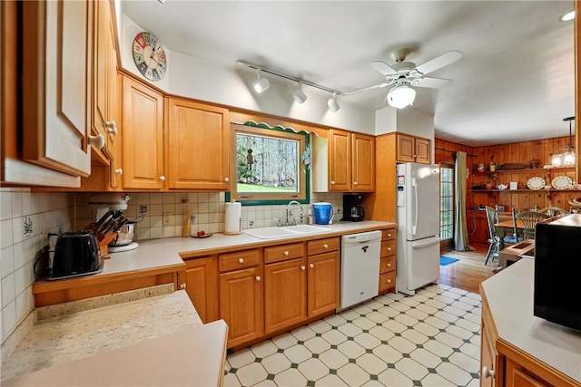 kitchen with ceiling fan, a sink, light countertops, light floors, and white appliances