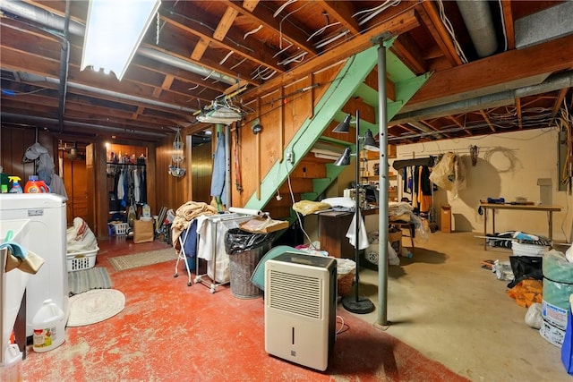 unfinished basement with washer / dryer and stairway