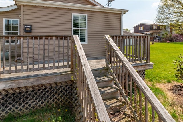 wooden terrace with a lawn