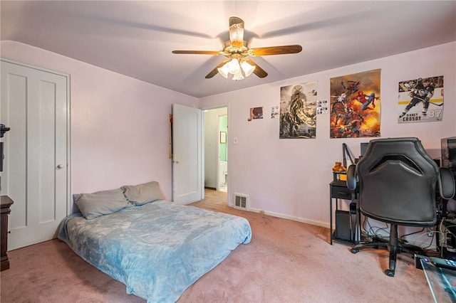 bedroom with a ceiling fan, baseboards, visible vents, and light carpet