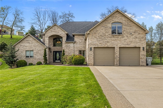 127 Bridle Trl, Peters Twp, PA 15367 - view of front facade featuring a garage, a front lawn, roof with shingles, brick siding, and concrete driveway