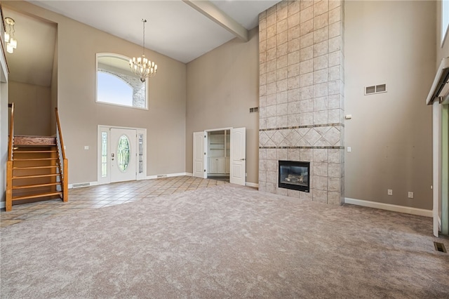 127 Bridle Trl, Peters Twp, PA 15367 - unfurnished living room featuring visible vents, high vaulted ceiling, baseboards, carpet floors, and stairs