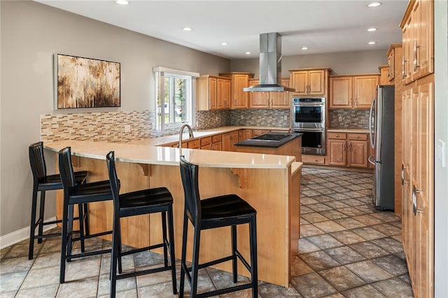 127 Bridle Trl, Peters Twp, PA 15367 - kitchen with recessed lighting, stainless steel appliances, a peninsula, and island range hood