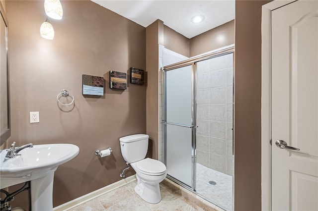 127 Bridle Trl, Peters Twp, PA 15367 - bathroom featuring tile patterned flooring, a shower stall, a sink, baseboards, and toilet