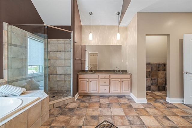 127 Bridle Trl, Peters Twp, PA 15367 - full bath featuring a sink, stone tile floors, baseboards, a shower stall, and a garden tub