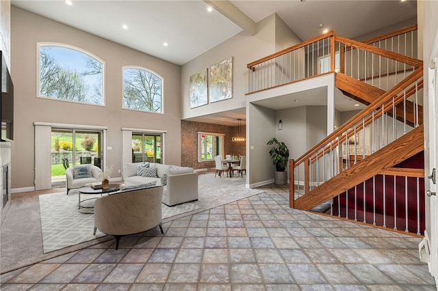 127 Bridle Trl, Peters Twp, PA 15367 - living area featuring a towering ceiling, stairs, stone tile flooring, and recessed lighting