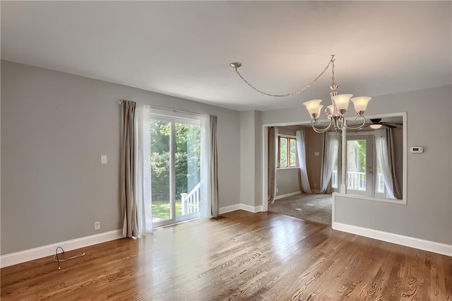 1060 Cherry Hill Rd, North Sewickley Twp, PA 16117 - empty room with baseboards, wood finished floors, and a notable chandelier