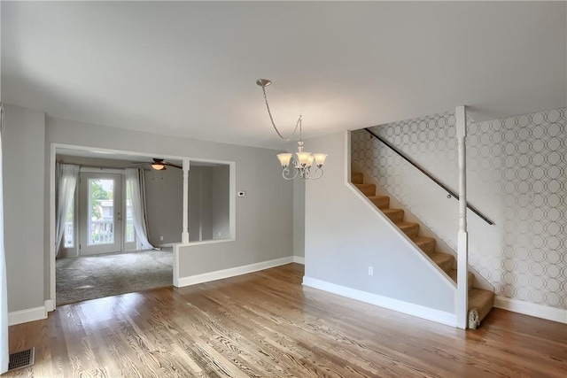 1060 Cherry Hill Rd, North Sewickley Twp, PA 16117 - interior space with visible vents, wood finished floors, baseboards, stairway, and ceiling fan with notable chandelier