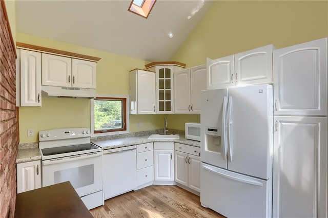 1060 Cherry Hill Rd, North Sewickley Twp, PA 16117 - kitchen with a skylight, a sink, glass insert cabinets, under cabinet range hood, and white appliances