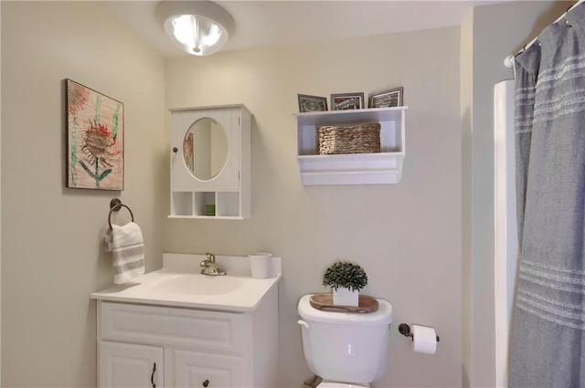 full bathroom with vanity and toilet