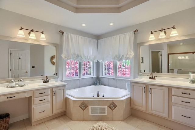 full bathroom with a sink, tile patterned flooring, a bath, and visible vents