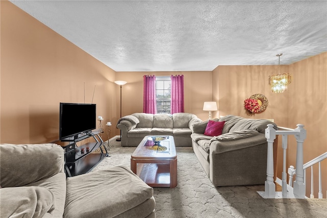 948 Broglie Dr, South Park, PA 15236 - carpeted living area with an inviting chandelier, baseboards, and a textured ceiling
