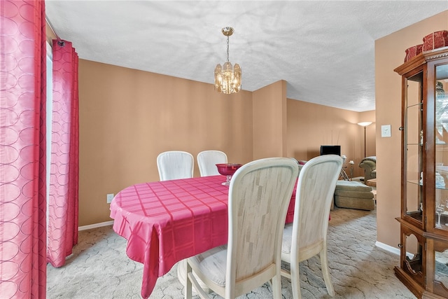 948 Broglie Dr, South Park, PA 15236 - dining space featuring baseboards, carpet flooring, a textured ceiling, and a chandelier