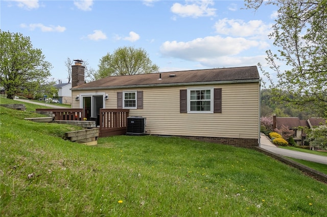 948 Broglie Dr, South Park, PA 15236 - back of house featuring a lawn, a wooden deck, a chimney, and cooling unit