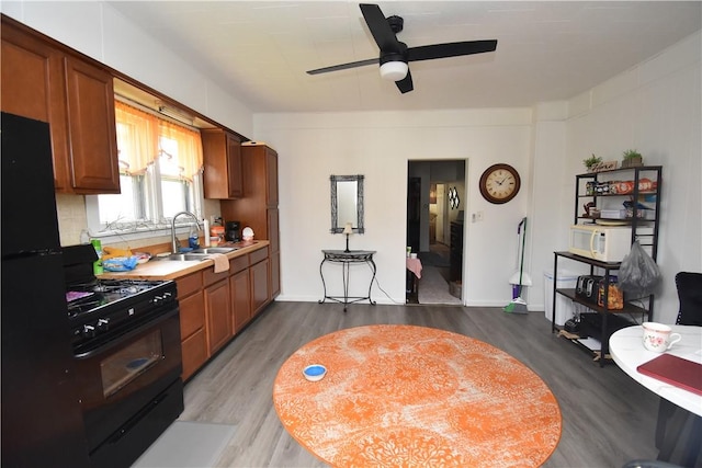 407-409 4th Ave, Ford City Boro, PA 16226 - kitchen with ceiling fan, a sink, light countertops, dark wood-style floors, and black appliances