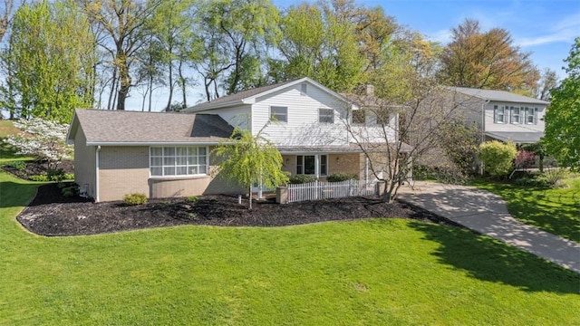 638 Morningstar Dr, Franklin Twp, PA 16117 - view of front facade with brick siding, a front yard, and a porch