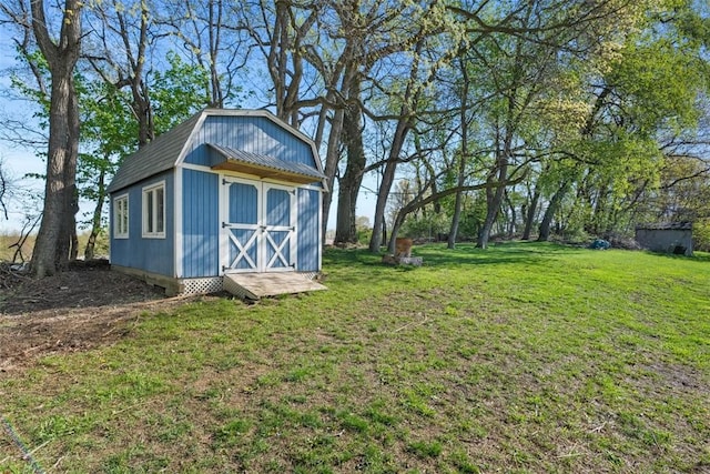 638 Morningstar Dr, Franklin Twp, PA 16117 - view of yard with a storage unit and an outbuilding