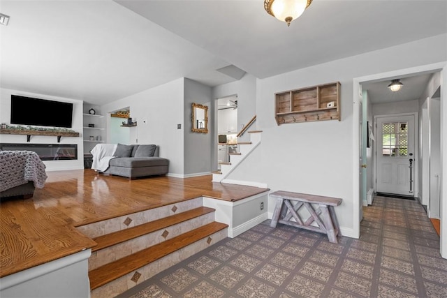 638 Morningstar Dr, Franklin Twp, PA 16117 - interior space featuring baseboards, a glass covered fireplace, built in features, and visible vents