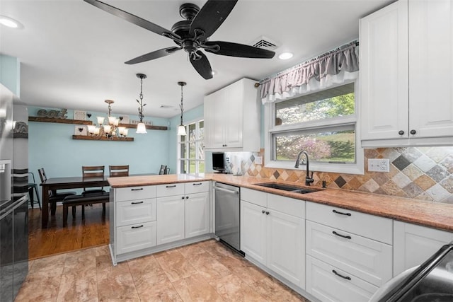 638 Morningstar Dr, Franklin Twp, PA 16117 - kitchen with stainless steel dishwasher, visible vents, a peninsula, white cabinetry, and a sink